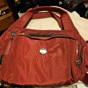 A small shoulder or crossbody purse with a ton of pockets to carry everything!